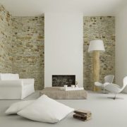 Imagen de salón con piedra natural en la pared, suministro e instalación por casdel stone